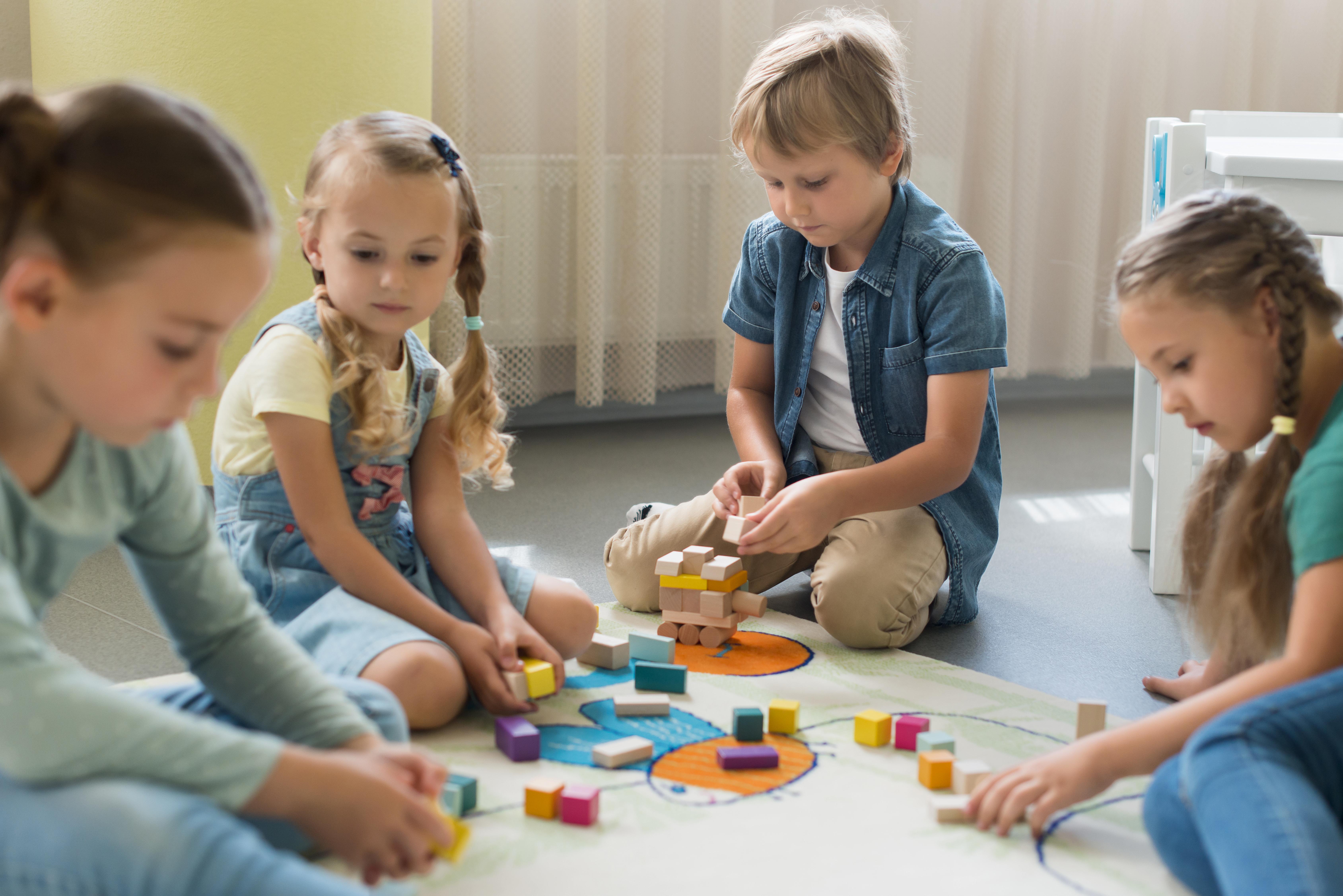 front-view-children-playing-together-in-kindergarten.jpg